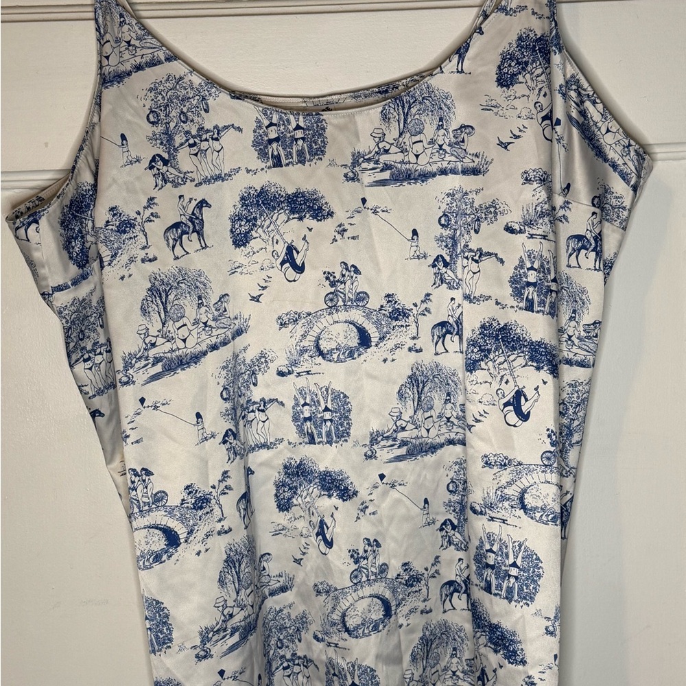 Parade: Blue and White Silky Women’s Top